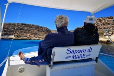 7 hours Boat trip to Lampedusa lunch, SUP and Snorkeling - La Tabaccara inlet: clear water, strong views, wind rules