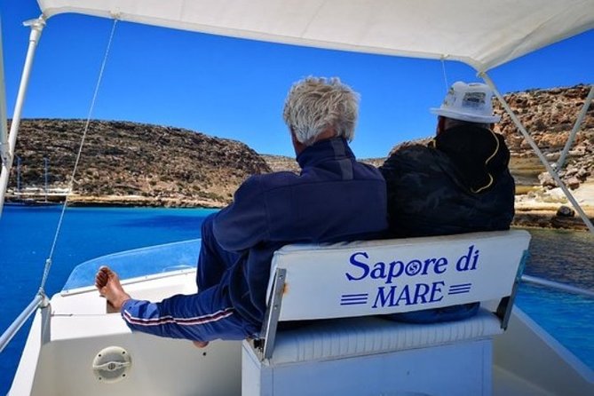 7 hours Boat trip to Lampedusa lunch, SUP and Snorkeling - La Tabaccara inlet: clear water, strong views, wind rules