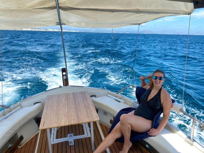 Alcudia: Traditional Wooden Boat Trip with Snorkeling - The Aucanada Lighthouse leg: scenic views, no rush