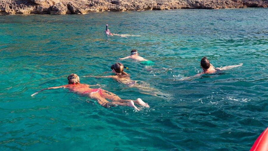 Alghero: Snorkeling Boat Tour in Porto Conte and Capo Caccia - Carlo and the guide style: fun, pacing, and real stories