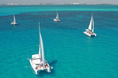 All-Inclusive Isla Mujeres Catamaran with Free Transportation - Boarding the Oceanix Catamaran: Snacks, Safety, and a Mimosa