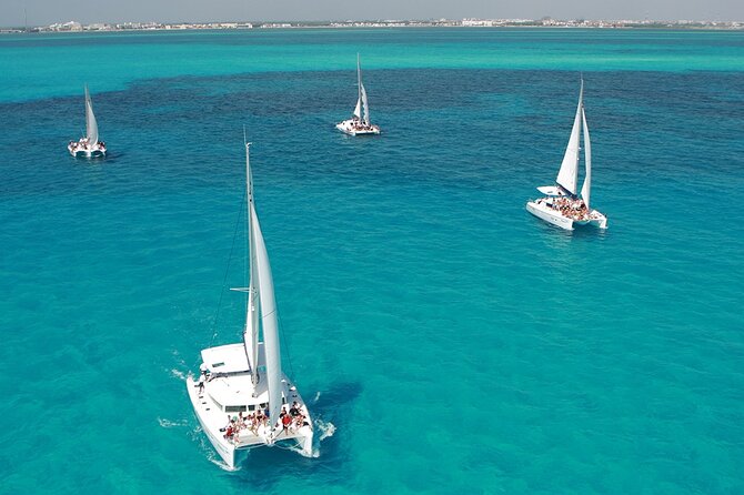 All-Inclusive Isla Mujeres Catamaran with Free Transportation - Boarding the Oceanix Catamaran: Snacks, Safety, and a Mimosa