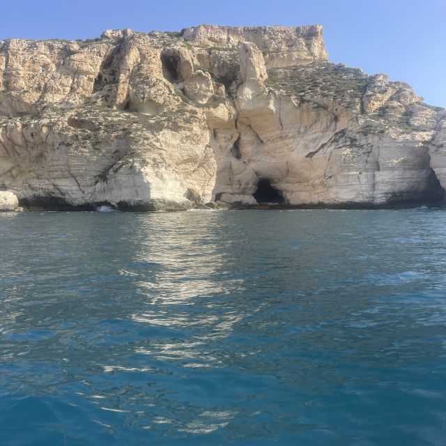 Cagliari: Boat Tour with Swim Stops, Snorkeling, & Aperitif - Cala Mosca plus a land break for food market time