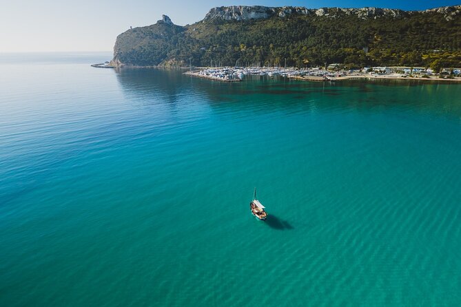 Cagliari : Gozzo Tour with 3 Swim Stops, Snorkeling & Local Food - Sella del Diavolo and the Cagliari coastline: city views without effort