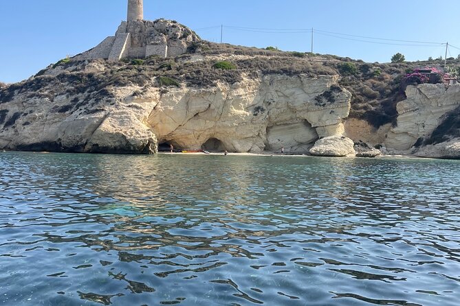 Cagliari Gulf Boat tour : 5 stops, snorkeling & local aperitif - Stop 2: Calamosca Beach for Emerald-Green Bay Water