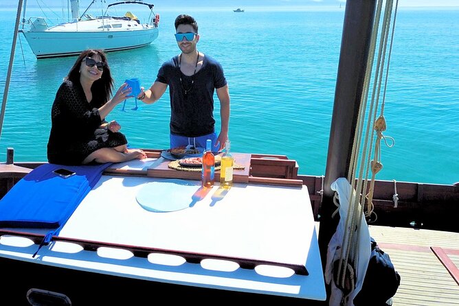 Cagliari Gulf Boat tour : 5 stops, snorkeling & local aperitif - Stop 1: Cala Bernat’s Aragonese Fortress Water Colors