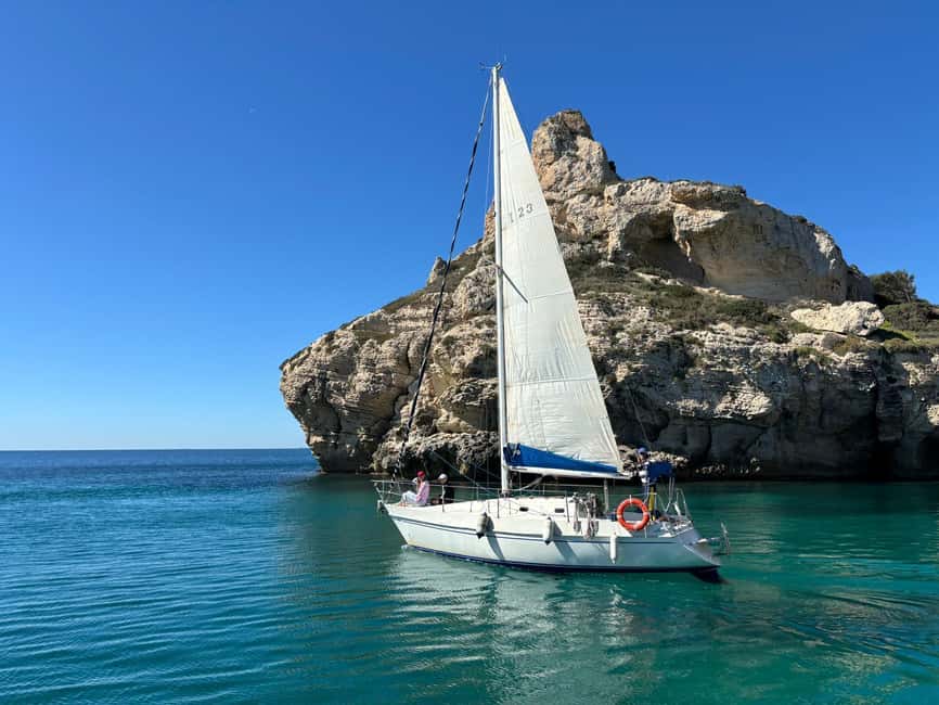 Cagliari Sailing Boat Tour with Snorkeling and Drink - Swim and snorkeling in natural pools with fish