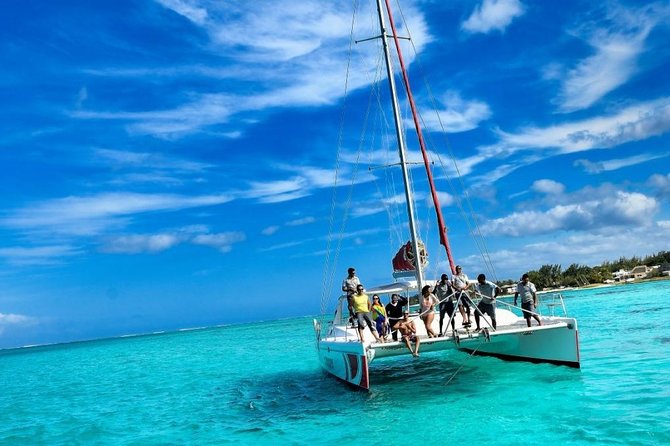 Catamaran Adventure Full Day: Ile aux cerfs,GRSE Waterfall,Snorkeling &BBQ Lunch - Snorkeling breaks plus BBQ lunch and unlimited drinks on board