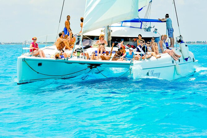 Catamaran to Isla Mujeres Snorkeling Tour with Open Bar and Lunch - Beach club and buffet lunch: relaxation with a clock ticking