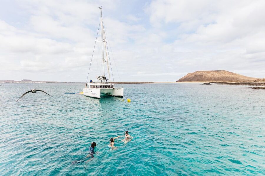 Corralejo: Lobos Island Catamaran Tour with Drinks & Snorkel - Lobos Island on foot: what you do besides the beach