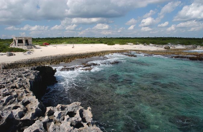 Cozumel Private Jeep Tour with Snorkeling Experience and Lunch - El Mirador lookout: souvenirs in huts, then a real climb for ocean views