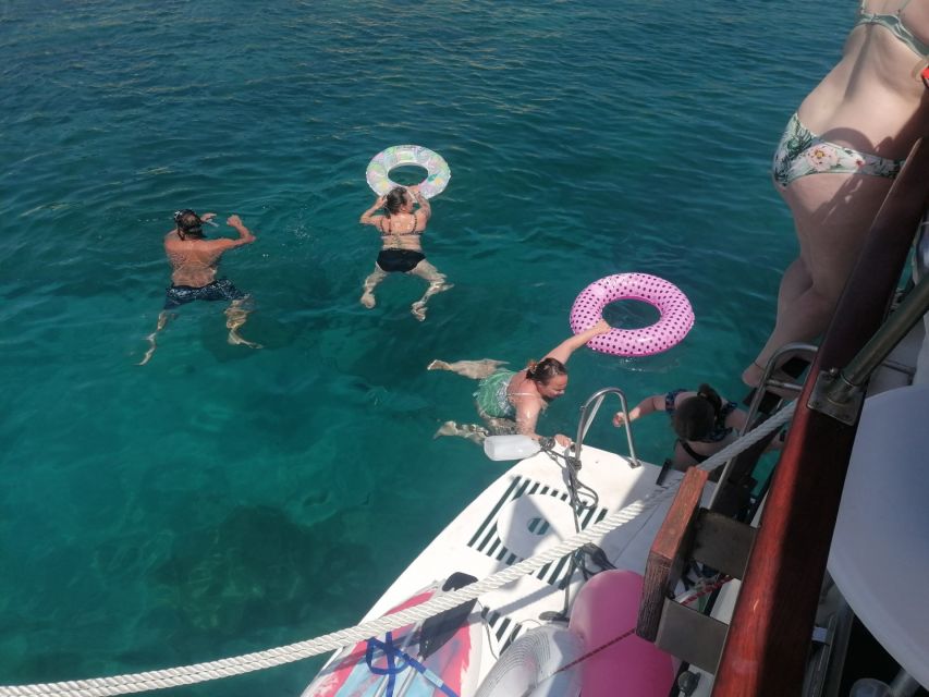 Crete: Snorkeling Boat Trip with Lunch and Transfer - Lunch on Board: Pork Sandwiches, Fruit, Dessert, and Wine