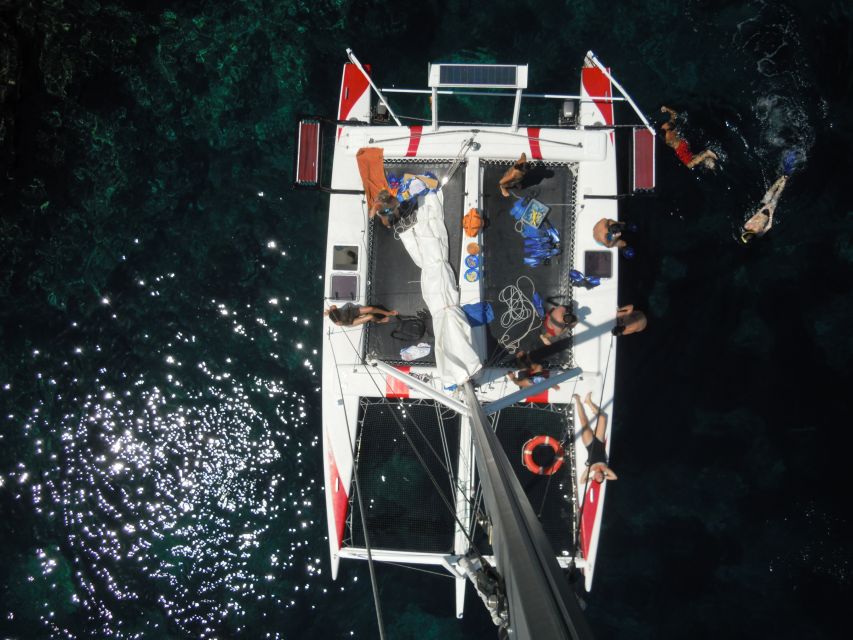 From Fornells: Half-Day Menorca Catamaran Trip w/ Snorkeling - The boat ride itself: fast, smooth, and what to expect onboard