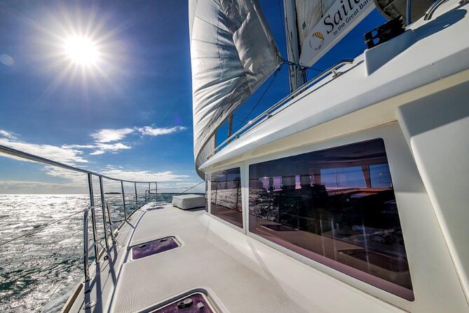 Full Day Low Isles Sailing & Snorkelling Cruise from Port Douglas - Low Isles island time: palm shade, lagoon snorkels, and a lighthouse walk