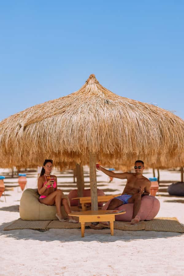 Hurghada: Hula Hula Speedboat w/ Optional Snorkeling & Lunch - Hula Hula Island time: sunbeds, shallow swimming, and that beach massage