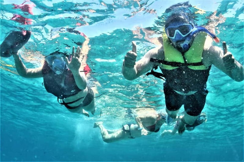 Ibiza: Snorkeling, Sunset Beach and Cave Boat Trip - Paddleboards on clear water: the best way to get playful
