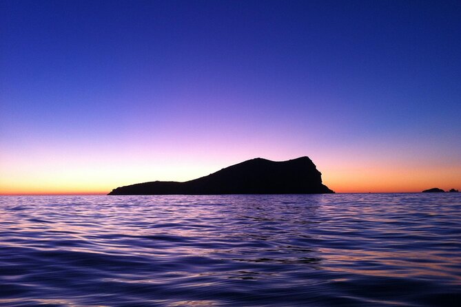 Ibiza Sunset Snorkeling Beach and Cave Tour - The sunset return to San Antonio Port: drinks, music, and deck time