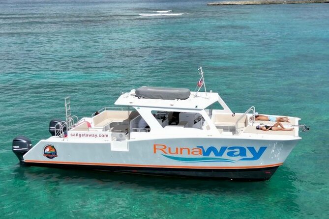 Icacos Double Dip Power Catamaran Snorkel & Beach Tour - Getting To Sail Getaways in Fajardo: find the white tent and the red-white-blue tree