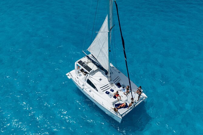 Isla Mujeres Day Tour with Catamaran, Snorkeling & Beach Club - Snorkeling at Bahia Mujeres: Great Water, Real-World Comfort Level