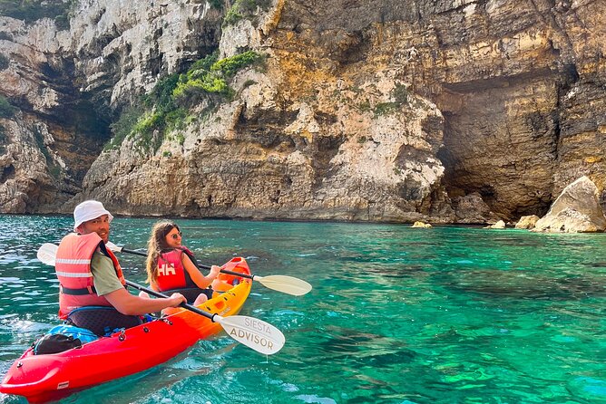 Kayak Paradise: Cala Portixol Snorkel, Cave & Cliff Jumping Tour - Cap Negre: getting panoramic views from a 100-meter rock
