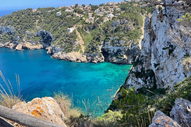 Kayak Paradise: Cala Portixol Snorkel, Cave & Cliff Jumping Tour - Isla de Portixol’s cave and the blue lagoon cliff-jump moment