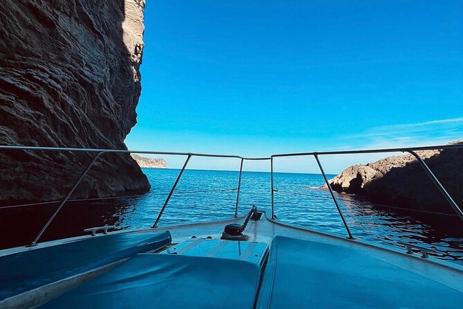 Mallorca Beach & Caves 4hr Boat Trip Drinks, Tapas, SUP & Snorkel - Alcanada Lighthouse and the finish zone: snacks, sun, and more water time
