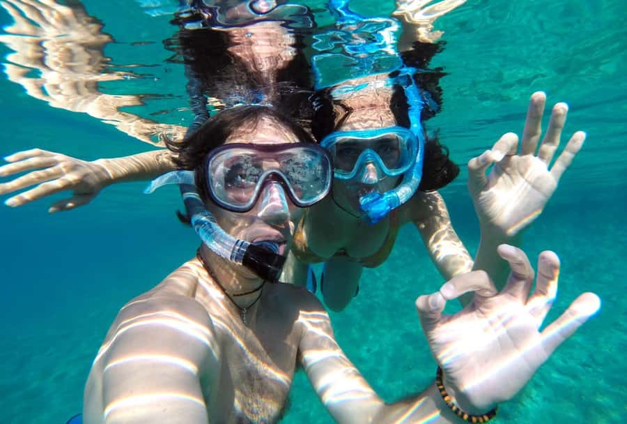 Matemwe: Mnemba Island Dolphin & Snorkeling Boat Trip - The onboard extras: fruit, water, and small comforts that matter