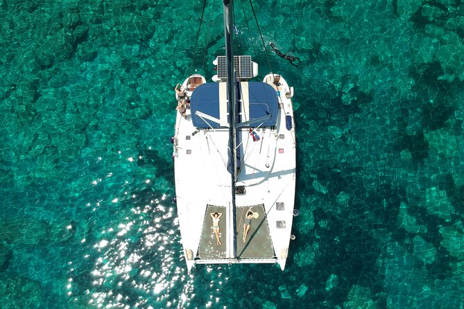 Milos caves snorkelling Catamaran Cruise in a small group - Sikia Beach and the cave dinghy run: masks on, cave exploration by small boat