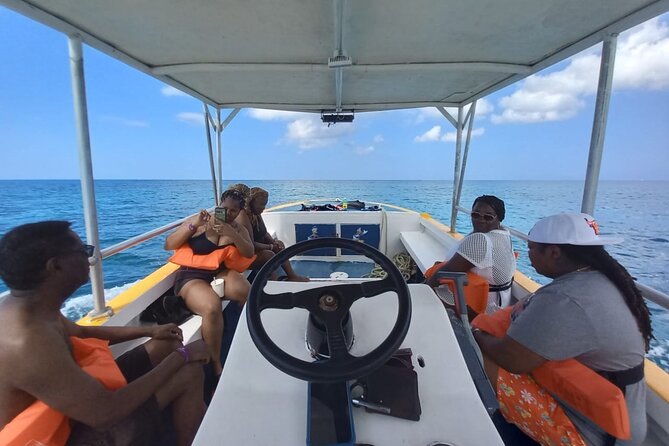 Negril Glass Bottom Boat Tour Snorkeling and Booby Cay - Safety and guide style: calm instructions, hands-on help