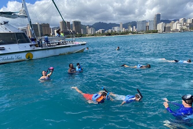 Oahu Catamaran Snorkel Tour: See Turtles 100% Guaranteed - Waikiki cruise time: scenic views with a calmer onboard vibe