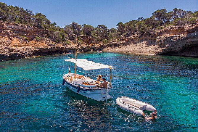 Private 4-hour Mediterranean Boat Tour in Ibiza with Snorkeling - Stop 2: Cala Saladeta, caves, and the choice to trek