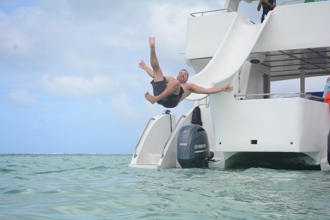 Private Catamaran with Sound system, Slide, Open bar & Snorkeling - Crew, service, and multilingual support