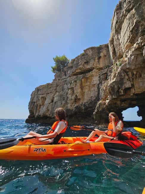 Pula: Cave Kayak Tour, Snorkeling and Island Jumping - Swimming, cliff jumping, and the safety vibe