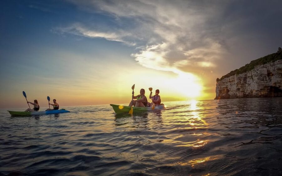 Pula: Kayaking,Snorkeling, Cliff jumping Tour with Wetsuit - The kayaking rhythm: sightseeing plus real paddling along Pula’s coastline