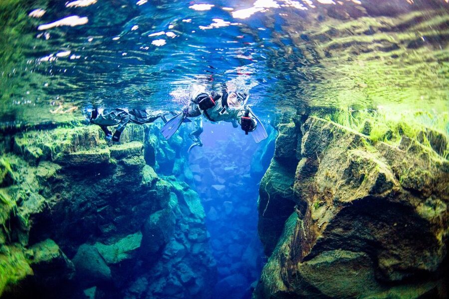 Reykjavik: Silfra Snorkeling & Lava Tunnel Adventure Combo - Snorkeling Silfra: floating through blue water with a guide at your side