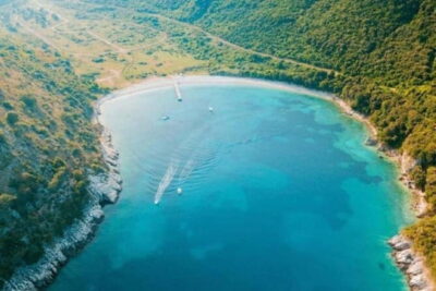 Sarandë: Boat Tour at Kroreza & Hidden Caves with Snorkeling - On the water with Brothers LR: Adi at the helm, music on deck, fridge for your snacks