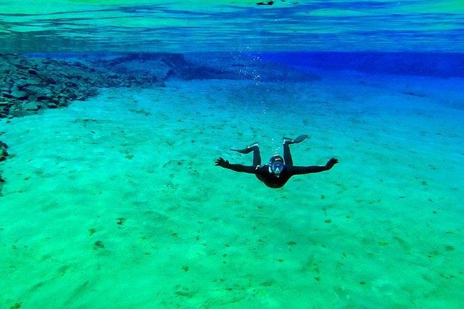 Silfra Wetsuit Snorkeling - Meet on Location | Free Photos - Wetsuit vs Drysuit: Staying Warm in 2°C Water