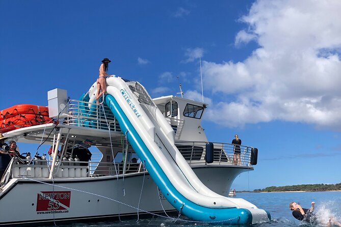 Small Group Coral Gardens Snorkel & Waterslide Adventure - The 25-foot waterslide rules, wind, and safety reality