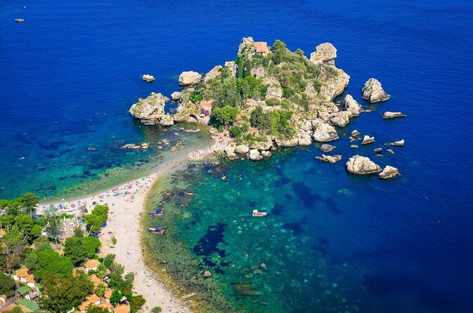 Snorkeling Tour Coast to Coast Taormina and Isola Bella - Boat comfort, shade, and the sea-state reality check