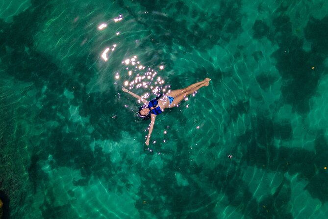 Tulum Guided Tour, Magical Cenote, Lagoon Snorkeling and Beachside Lunch - Yal Ku Lagoon snorkeling: where brackish water brings the fish close