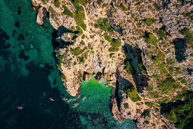 Uncharted Marine Reserve Cave, Snorkel & Cliff Jumping Kayak Tour - Cala Tango Cliff Jumping: How the Heights and Options Work