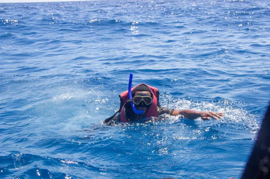 Zanzibar: Mnemba island Snorkeling & Boat Tour with Lunch - Getting to Mnemba: van pickup and a smooth water handoff